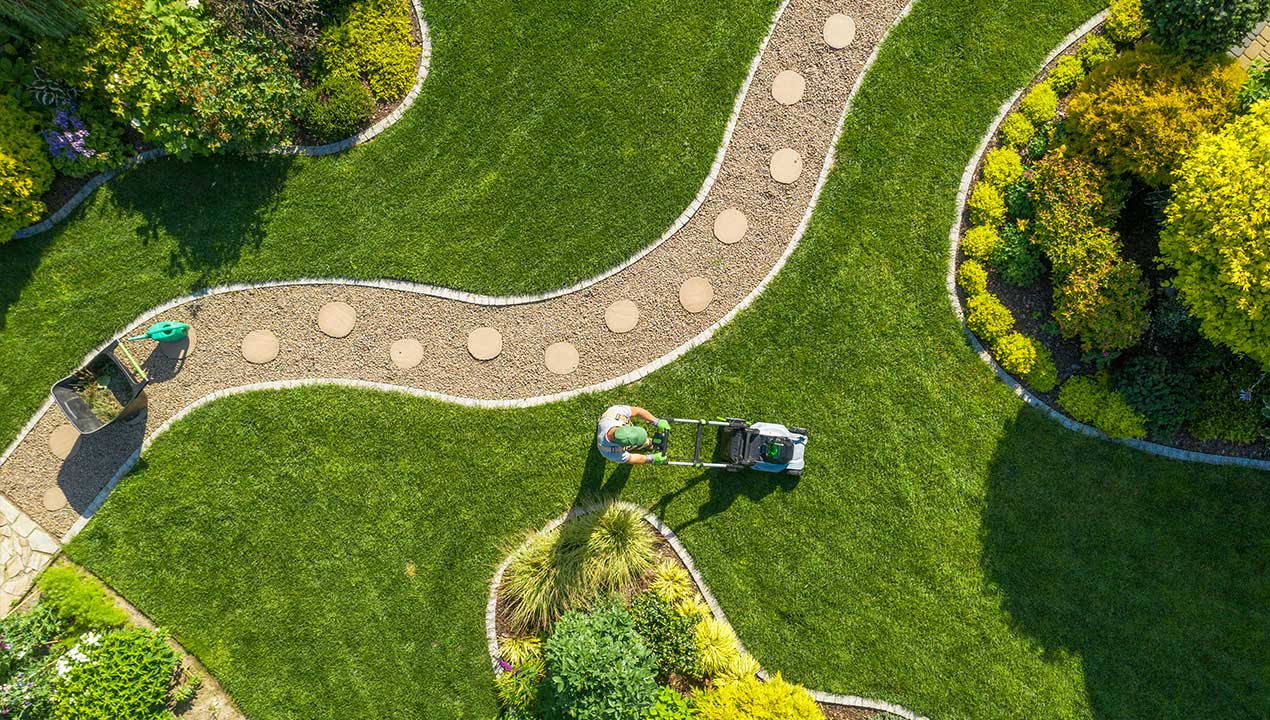 Gardener mowing the lawn